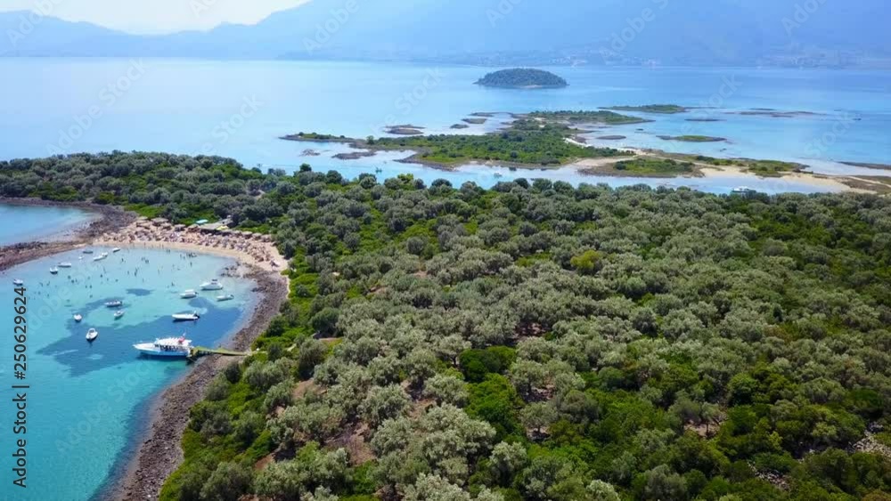 Aerial view video from famous organised beach in small island of Monolia part of archipelago paradise exotic islands of Lihadonisia with clear turquoise sea beaches, North Evoia island, Greece Aerial view video from famous organised beach in small island of Monolia part of archipelago paradise exotic islands of Lihadonisia with clear turquoise sea beaches, North Evoia island, Greece