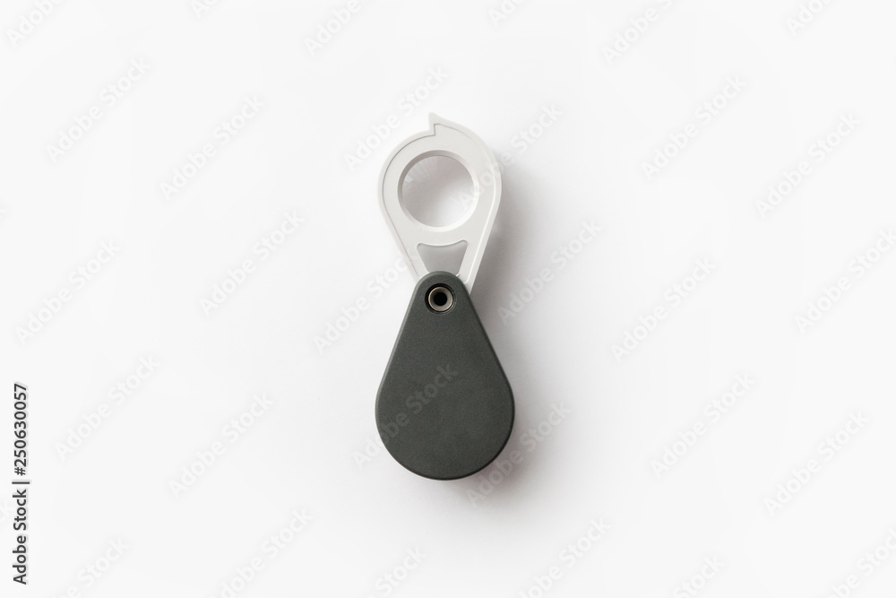 Magnifying glass for diamonds or see the amulet Isolated on a White Background. Magnifying glass for diamonds or see the amulet Isolated on a White Background.