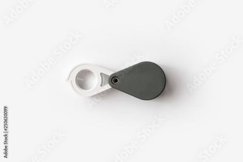 Magnifying glass for diamonds or see the amulet Isolated on a White Background.