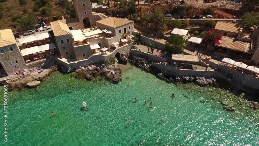 Aerial birds eye view video taken by drone of famous picturesque village of Limeni with turquoise clear waters, Peloponnese, Greece Aerial birds eye view video taken by drone of famous picturesque village of Limeni with turquoise clear waters, Peloponnese, Greece