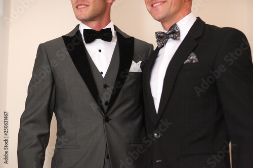 фотографія Men posing in tuxedo