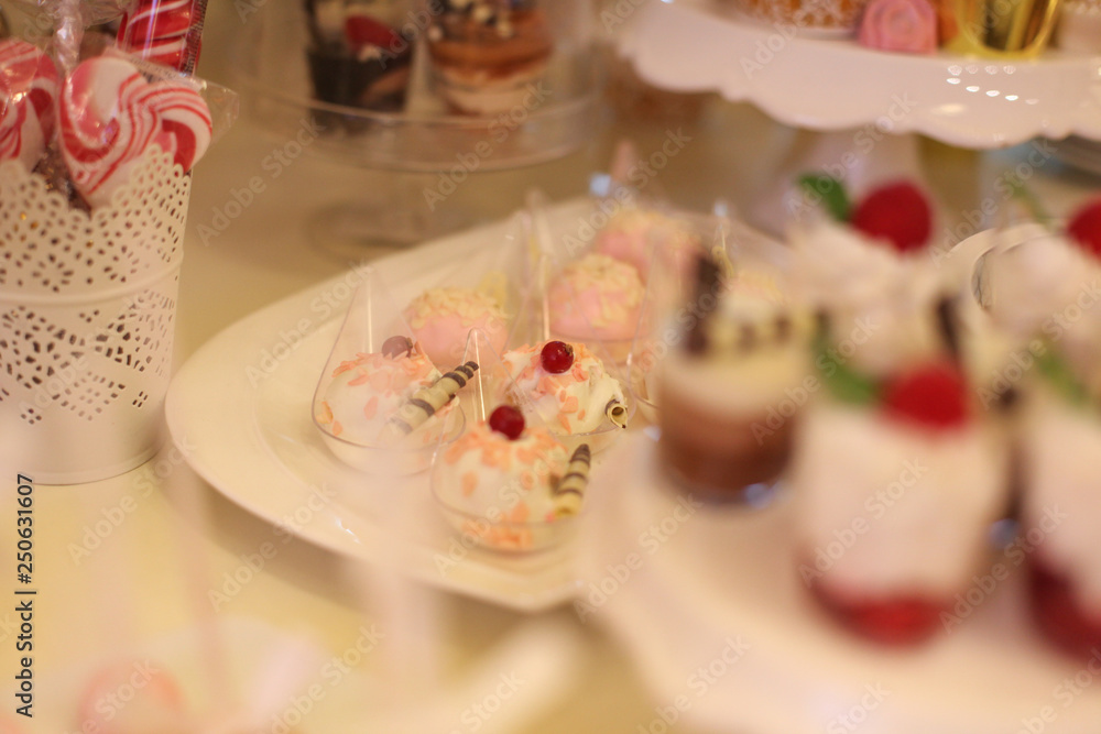 Delicious candy bar with macarons, cupcakes, cake pop and other sweets Delicious candy bar with macarons, cupcakes, cake pop and other sweets