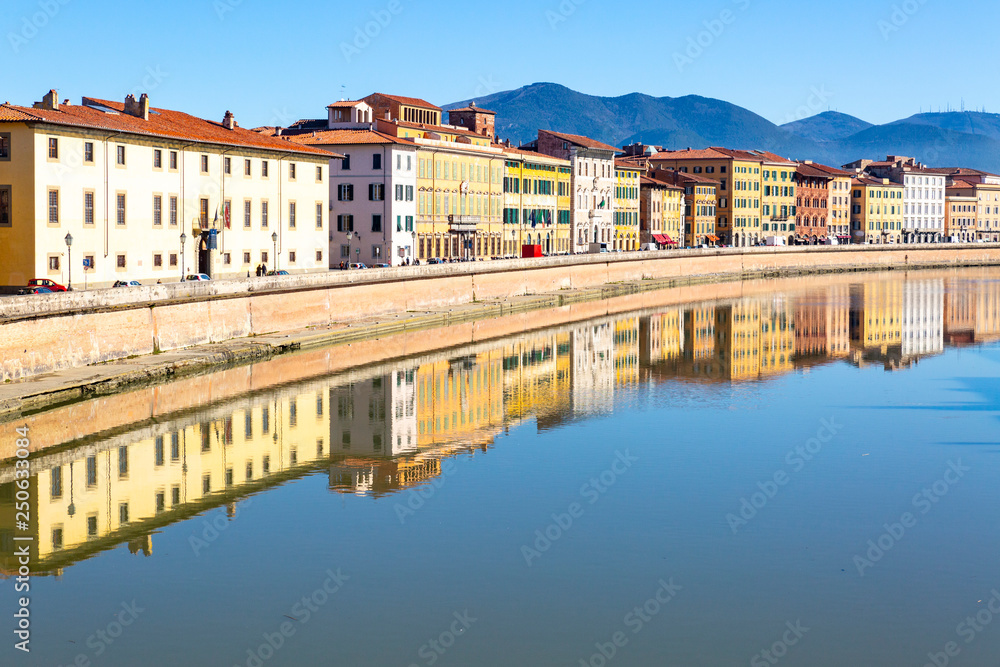Buildings in Pisa reflected in the Arno River