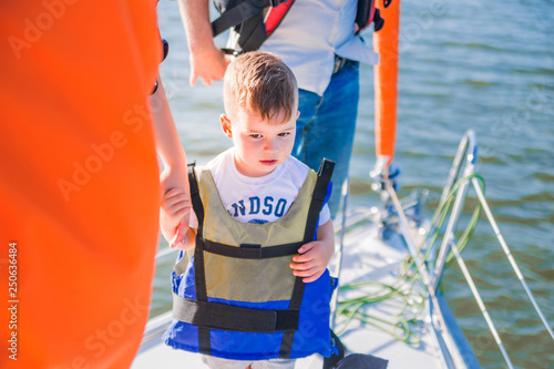 Little boy spends time on the yacht