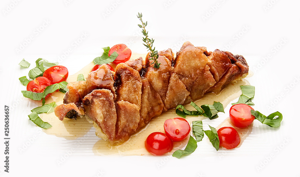 Fried pike perch with sauce and cherry tomatoes. On white background. Fried pike perch with sauce and cherry tomatoes. On white background.