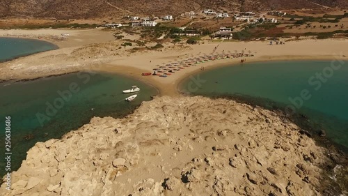 Aerial birds eye view video taken by drone of famous beach of Manganari, Ios island, Cyclades, Greece photo