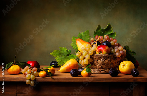 Still life with apple, grapes, pears and plums photo