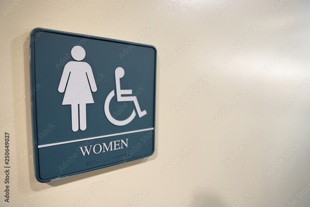 Women's bathroom sign with handicapped symbol and text space Women's bathroom sign with handicapped symbol and text space