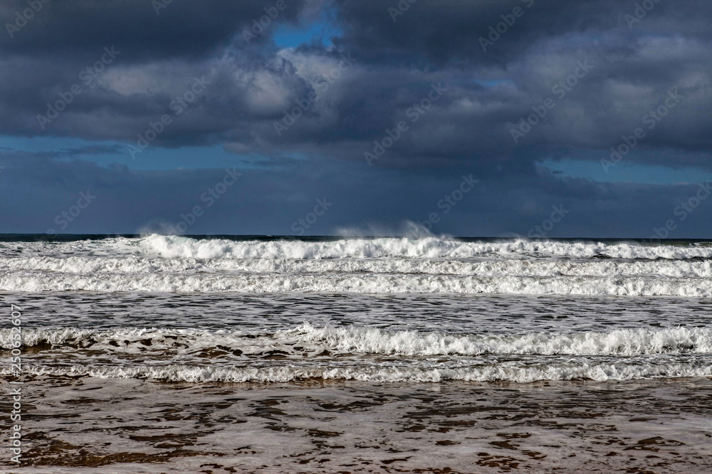 Storm clouds and waves at bells beach, great ocean road, australia Storm clouds and waves at bells beach, great ocean road, australia