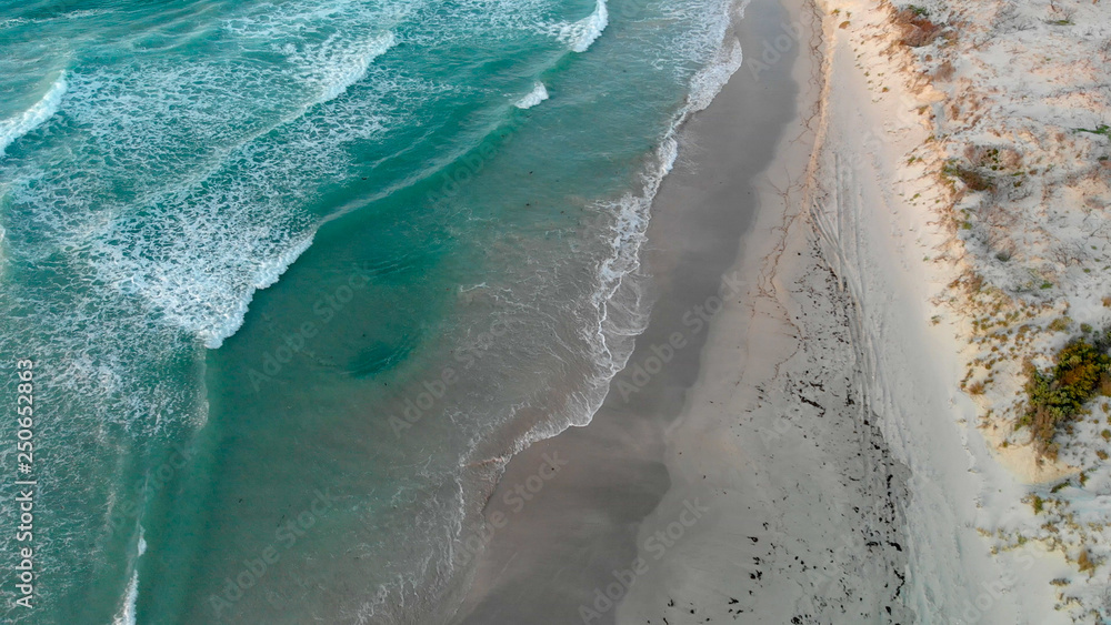 Waves on the beach, overhead aerial view
