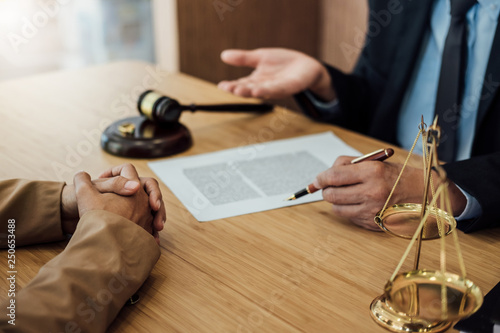 Marriage divorce on Judge gavel deciding, Consultation between a Businesswoman and Male lawyer or judge consult having yes or no to signing divorce documents, Law and Legal services concept