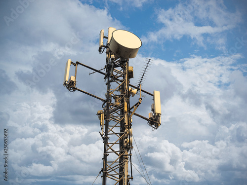 Base Station or Base Transceiver Station. Telecommunication tower. Wireless Communication Antenna Transmitter. Telecommunication tower with antennas against blue sky.