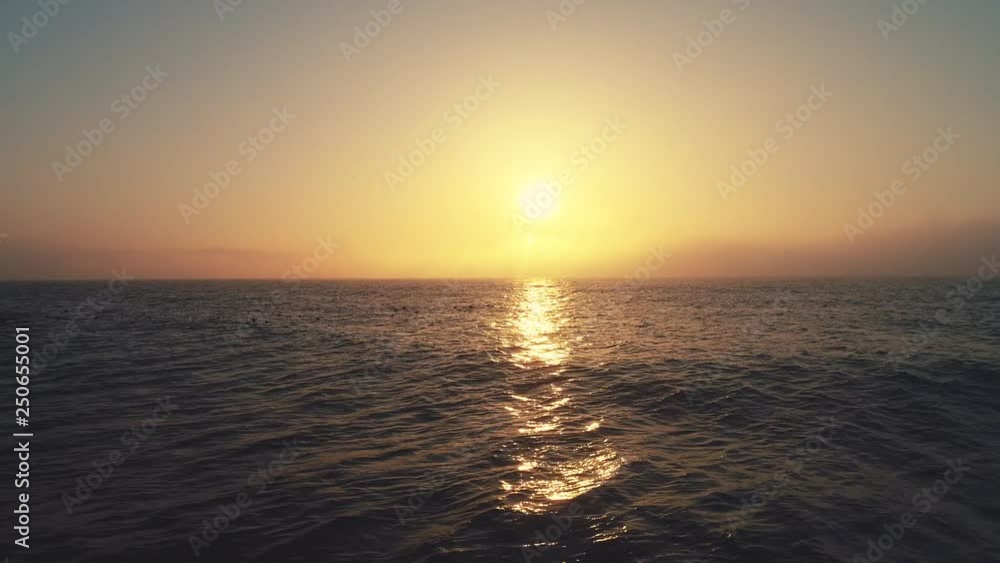 Sea sunrise and ripple waves, aerial view. Beautiful morning over the horizon. Sea sunrise and ripple waves, aerial view. Beautiful morning over the horizon.