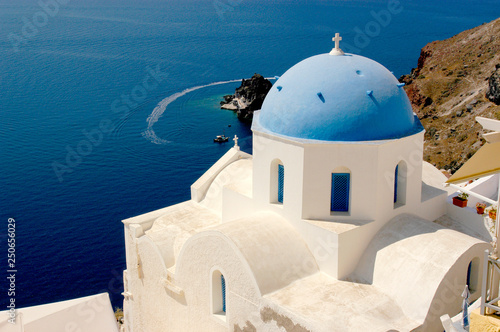 The iconic blue dome church on Santorini and the spectacular views over the Aegean ocean.