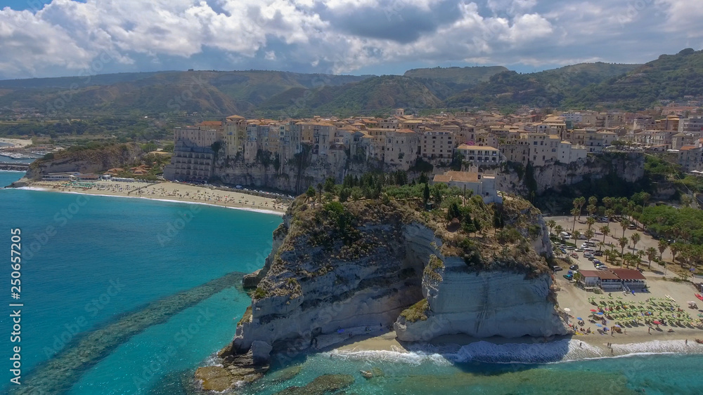 Tropea, Calabria. Aerial view of city, monastery and coastline from drone perspective.