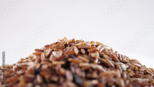 Pouring brown rice. photo