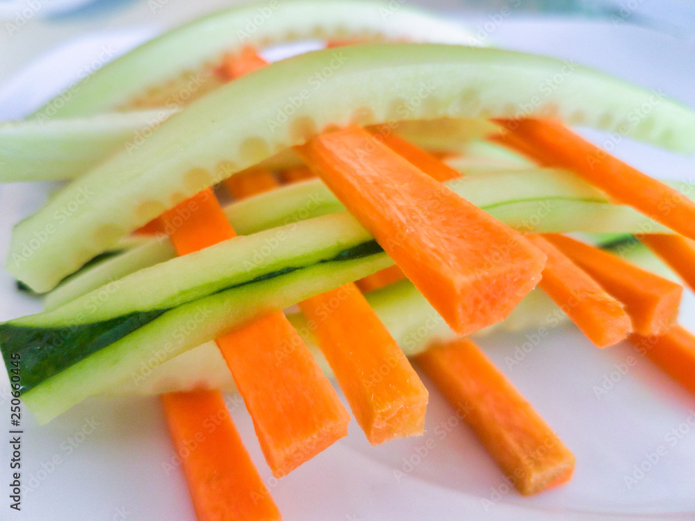 Close-up of carrot and cucumber sticks Close-up of carrot and cucumber sticks