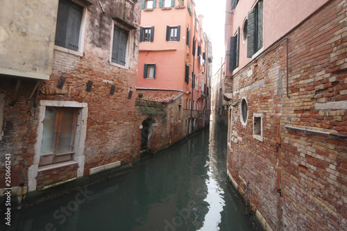 Ancient building surround with water in Venice on the canal, lifestyle in Italy, boat trip in Venezia, commercial advertisement