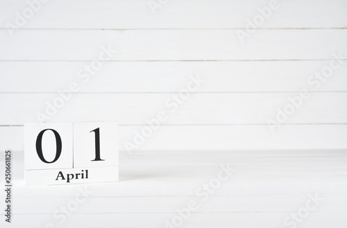 April 1st, Day 1 of month, Orissa Day, April fool's day, Birthday, Anniversary, wooden block calendar on white wooden background with copy space for text.