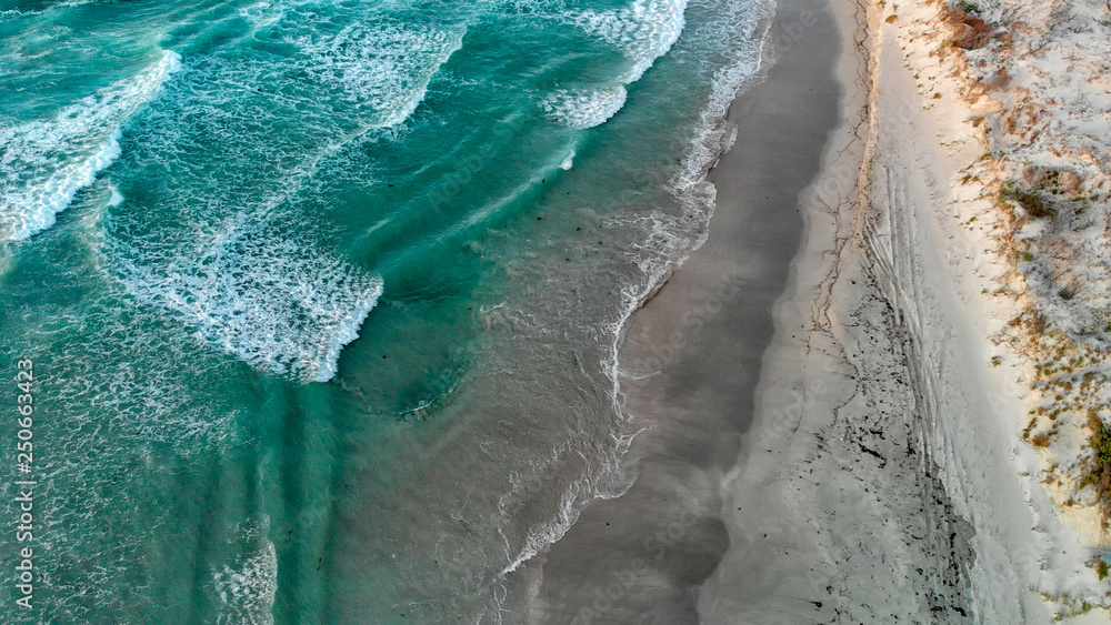 Waves on the beach, overhead aerial view