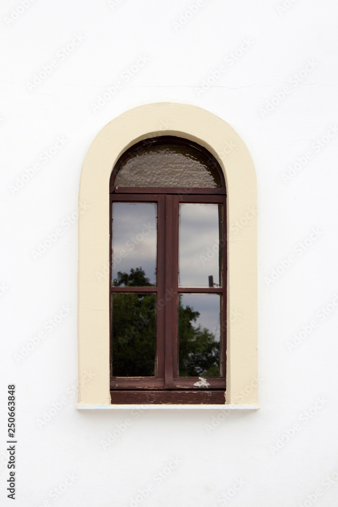 Arched window of church, Skiathos Town, Greece, August 18, 2017.