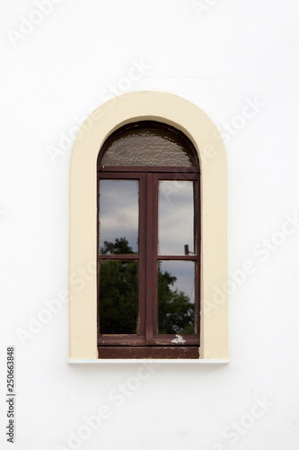 Arched window of church  Skiathos Town  Greece  August 18  2017.