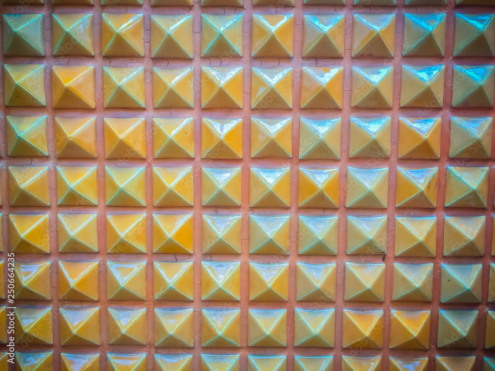 Abstract ceramic wall tiles in the shape of pyramid background. Geometric pattern of pyramid shapes. Abstract ceramic wall tiles in the shape of pyramid background. Geometric pattern of pyramid shapes.