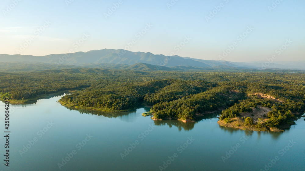 Naklejka premium Pong Chor Reservoir in Mae Wang National Park Chiang Mai, Thailand. Photo in aerial view by drone with beautiful nature. Abstract of peaceful, peace wallpaper background.
