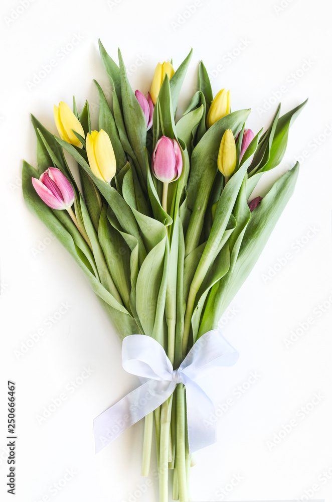 Spring big bouquet. Yellow and pink tulips. Spring card or background with space for text. Top view. Copy space. Mock-up Spring big bouquet. Yellow and pink tulips. Spring card or background with space for text. Top view. Copy space. Mock-up