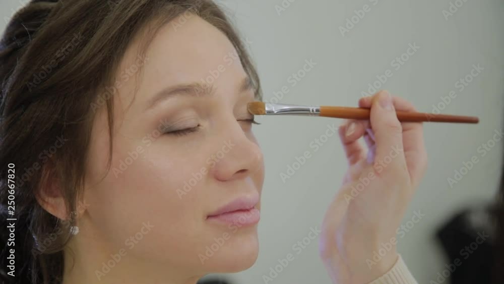 Professional makeup artist makes makeup a very beautiful woman. Professional makeup artist makes makeup a very beautiful woman.