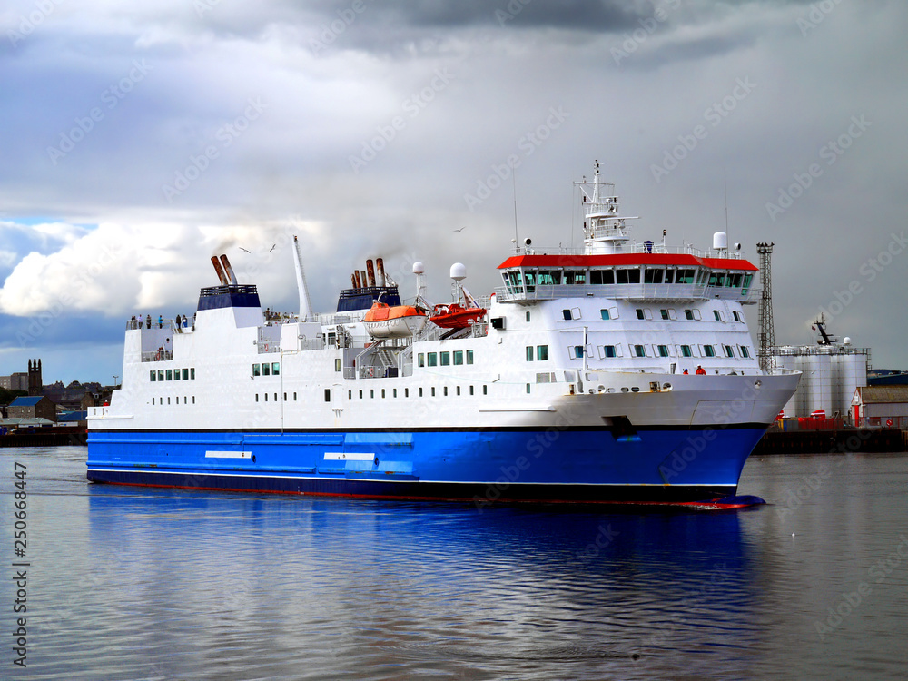 Fototapeta premium Passenger Cargo Ferry leaving harbou on passage to next port.