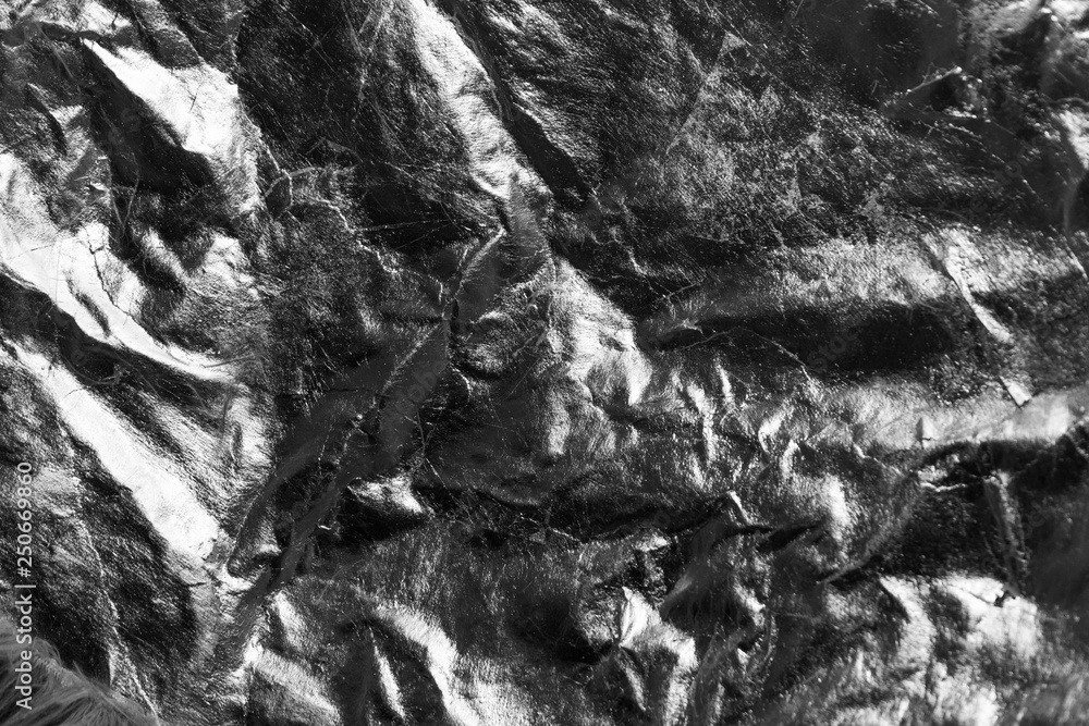 Grey crumpled reflective background, grunge style.