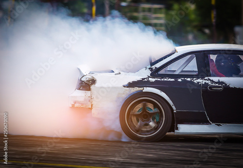 Blurred Race car drifting on speed track on twilight background.