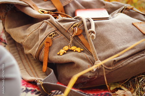 backpack traveler lies on the grass close-up. Stop to rest on the way.