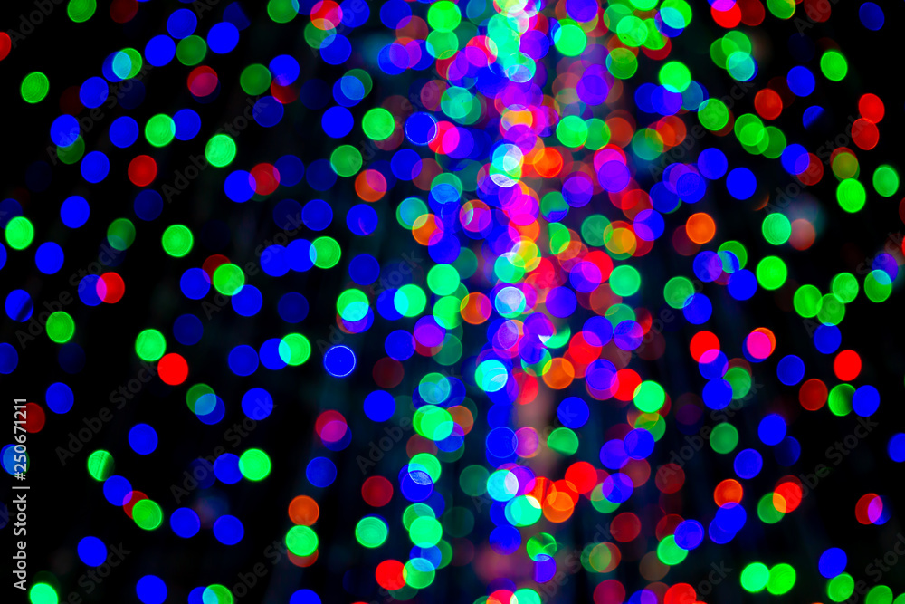 Beautiful bokeh blurred light from Christmas light bulbs background.