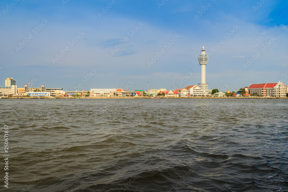 Riverfront view of Samut Prakan city hall with new observation tower and boat pier. Samut Prakan is at the mouth of the Chao Phraya River on Gulf of Thailand.