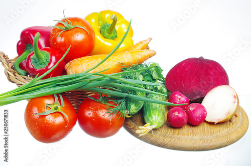 Appetizing vegetables. Tomatoes, cucumbers, onions, carrots, peppers, parsley.