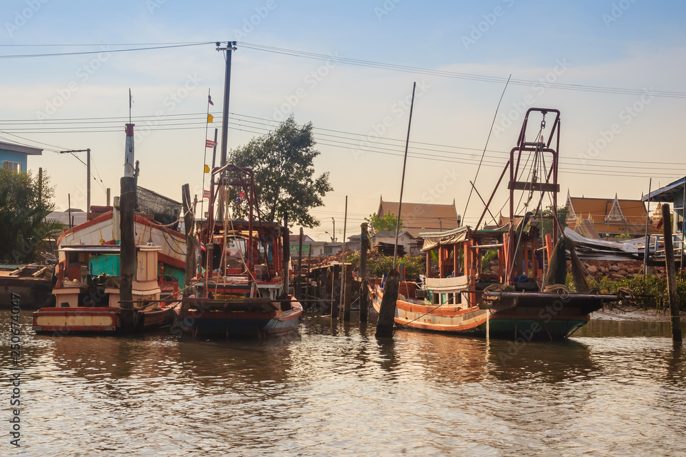 Samut Prakan, Thailand - March 25, 2017: Local ferry pier across Chao Phraya River at Phra Samut Chedi district, Samut Prakarn, Thailand. Samut Prakan, Thailand - March 25, 2017: Local ferry pier across Chao Phraya River at Phra Samut Chedi district, Samut Prakarn, Thailand.