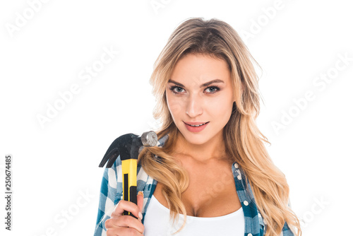 attractive blonde handy woman in blue shirt holding hammer isolated on white
