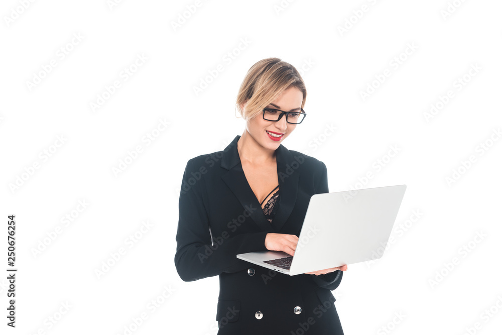 attractive businesswoman in black formal wear with open neckline typing on laptop isolated on white attractive businesswoman in black formal wear with open neckline typing on laptop isolated on white