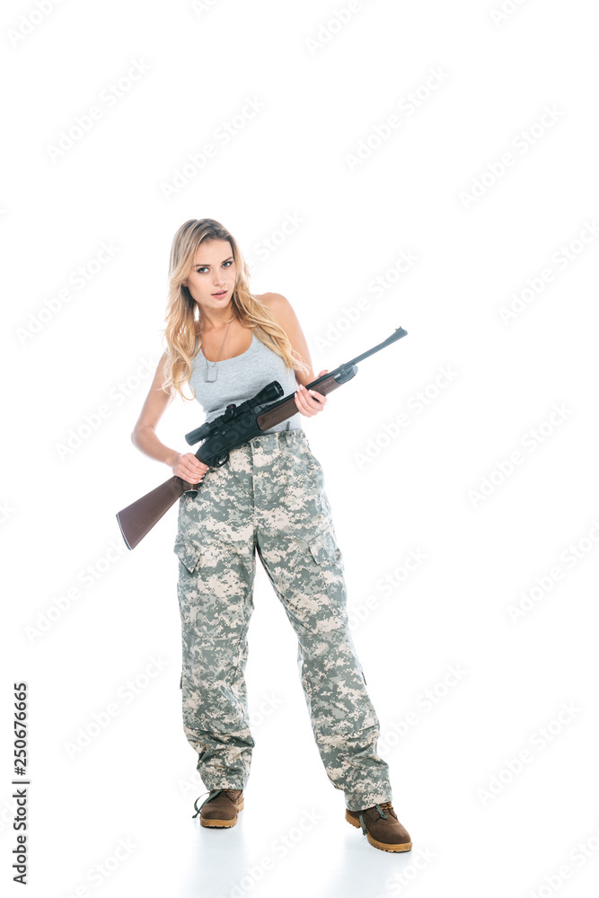 attractive blonde militarywoman in grey t-shirt and camouflage pants standing with rifle isolated on white attractive blonde militarywoman in grey t-shirt and camouflage pants standing with rifle isolated on white