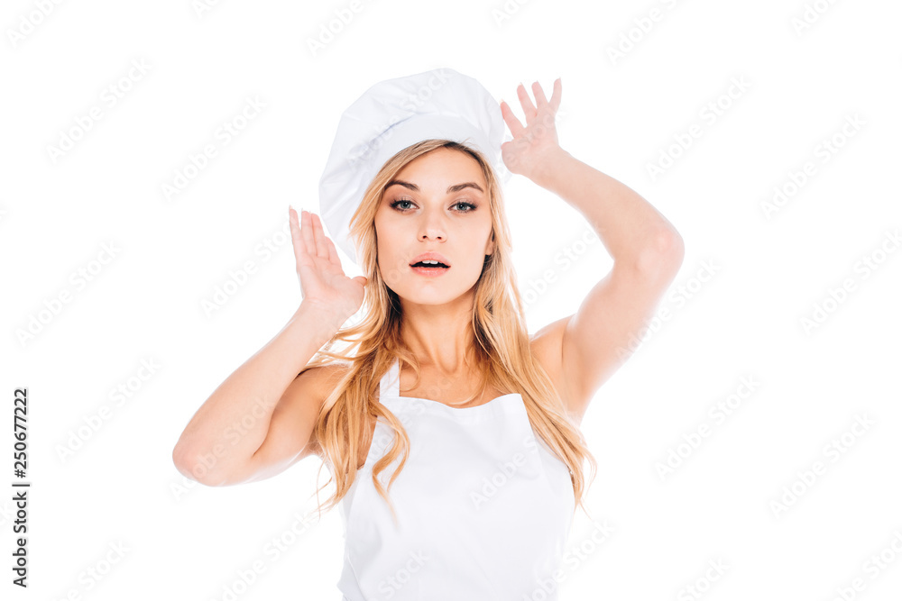 blonde woman in cook uniform correcting cap isolated on white blonde woman in cook uniform correcting cap isolated on white