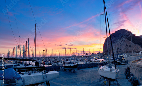 sunset at marina with mountain background