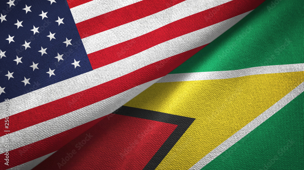 Obraz premium United States and Guyana two flags textile cloth, fabric texture