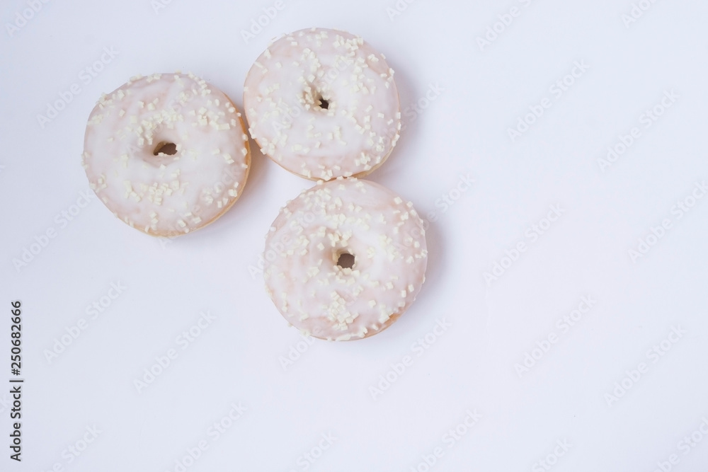 Donuts on the white bacground. Copy space. Top view. Donuts on the white bacground. Copy space. Top view.