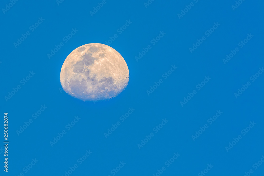 Half moon with sky blue background in evening seen from Bangkok, Thailand, clipping path. Half moon with sky blue background in evening seen from Bangkok, Thailand, clipping path.