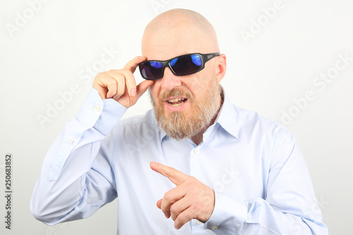 portrait of a bearded man wearing sunglasses © photosaint