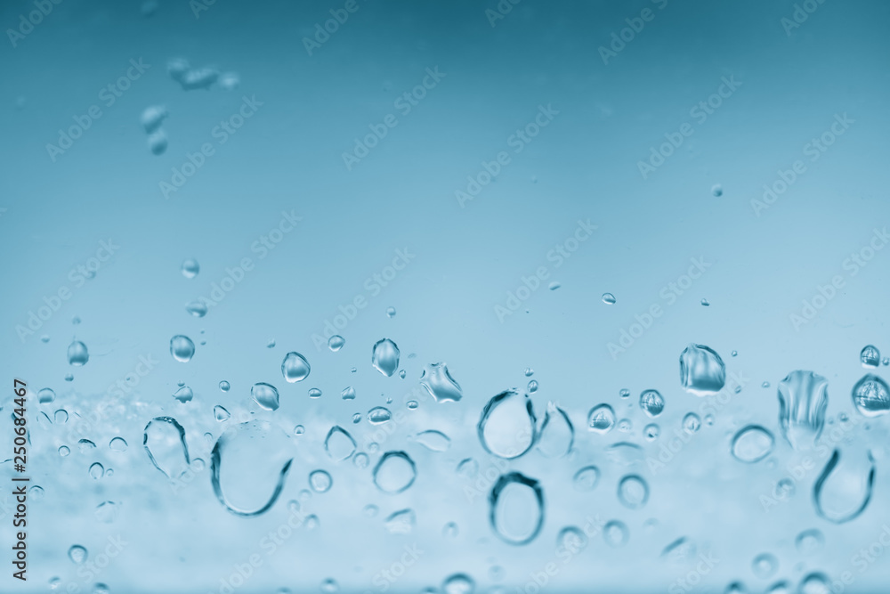 Window glass with frozen drops of rain. Atmospheric mint blue light background with raindrops. Frosty droplets close up. Detailed transparent aquamarine texture in macro with copy space. Rainy weather Window glass with frozen drops of rain. Atmospheric mint blue light background with raindrops. Frosty droplets close up. Detailed transparent aquamarine texture in macro with copy space. Rainy weather