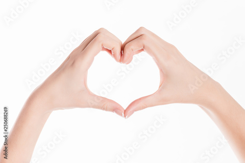 isolated background showing woman hands making a heart for saint valentines day