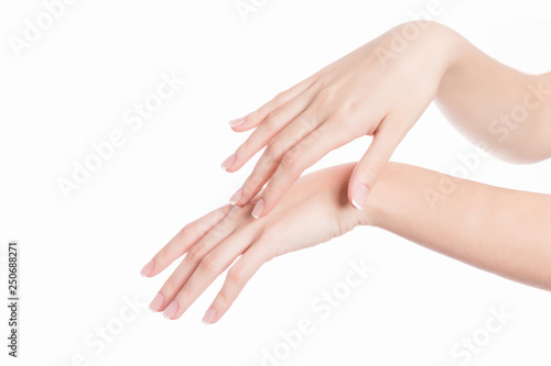 isolated background showing woman hands applying beauty care soft product © Esteban